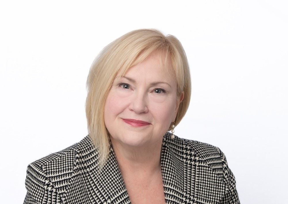 Town administrator Jacqui Beebe smiling at camera