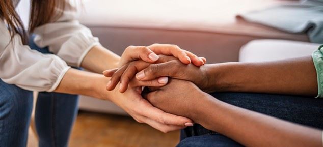 two people holding hands